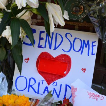 A handwritten sign that says "Send Some Love to Orlando" with a heart in the middle