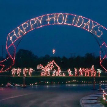 A holiday lights display that says "Happy Holidays." Photo Credit Sunshine Division. 