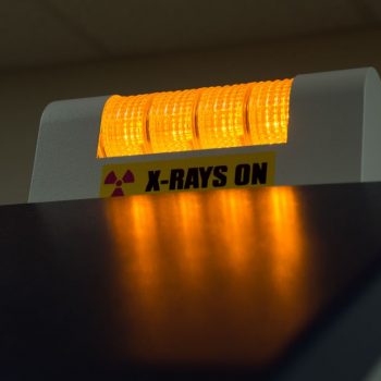 An x-ray machine with the words "X-RAYS ON" on it