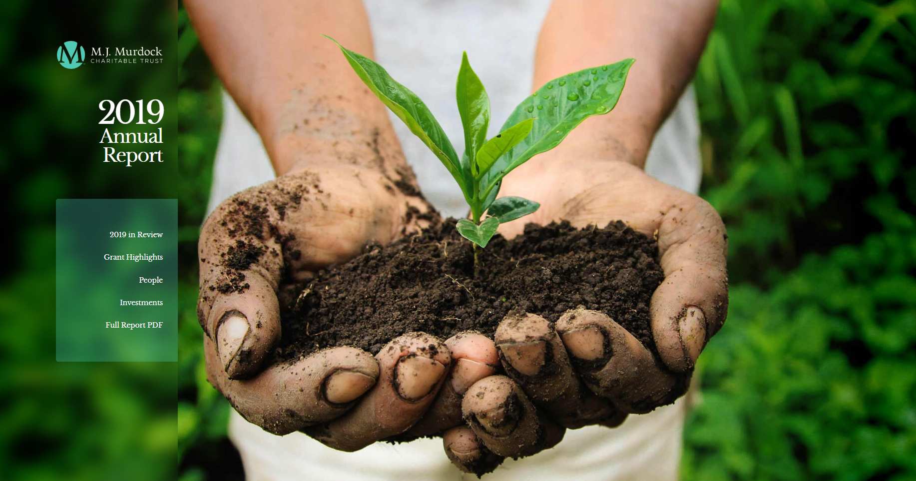 Close-up of two hands holding soil with a plant growing out of it. Text overlay that says "2019 Annual Report"