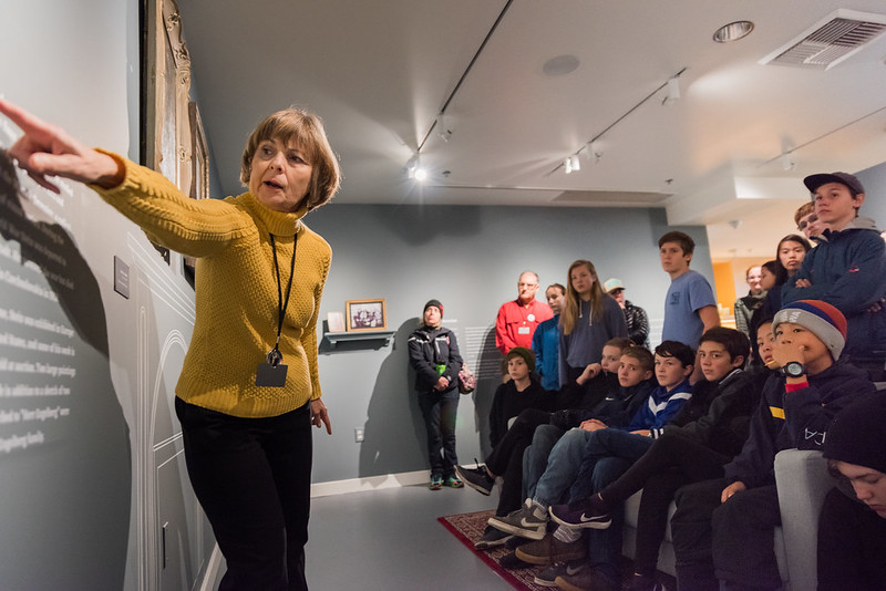 An educator at OJMCHE instructs viewers inside the museum.