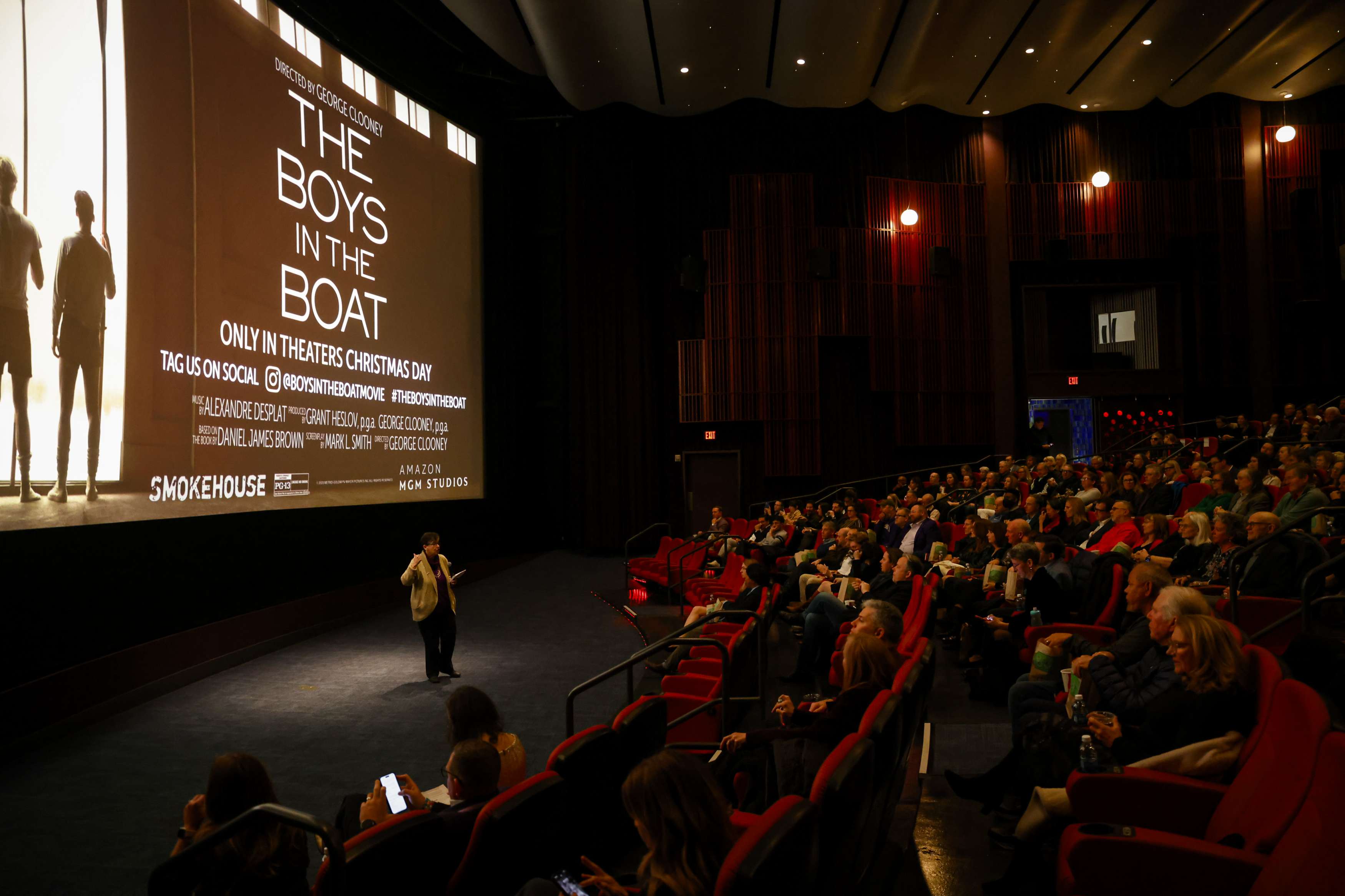 A full movie theater with a screen that says "The Boys in the Boat"