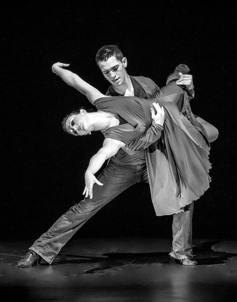 Black and white photo of two ballroom dancers performing a dip