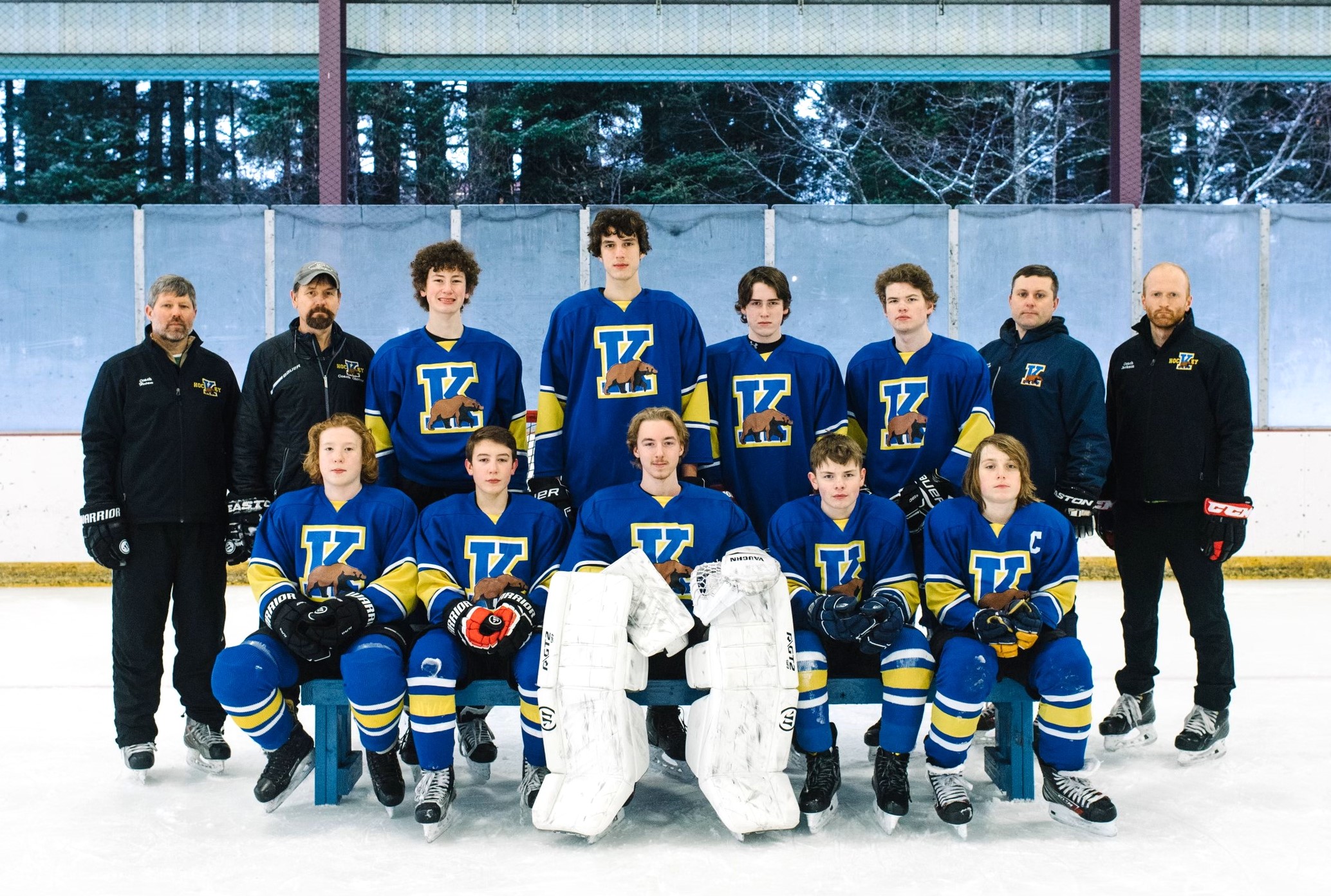 Group of male teenage hockey players on ice 