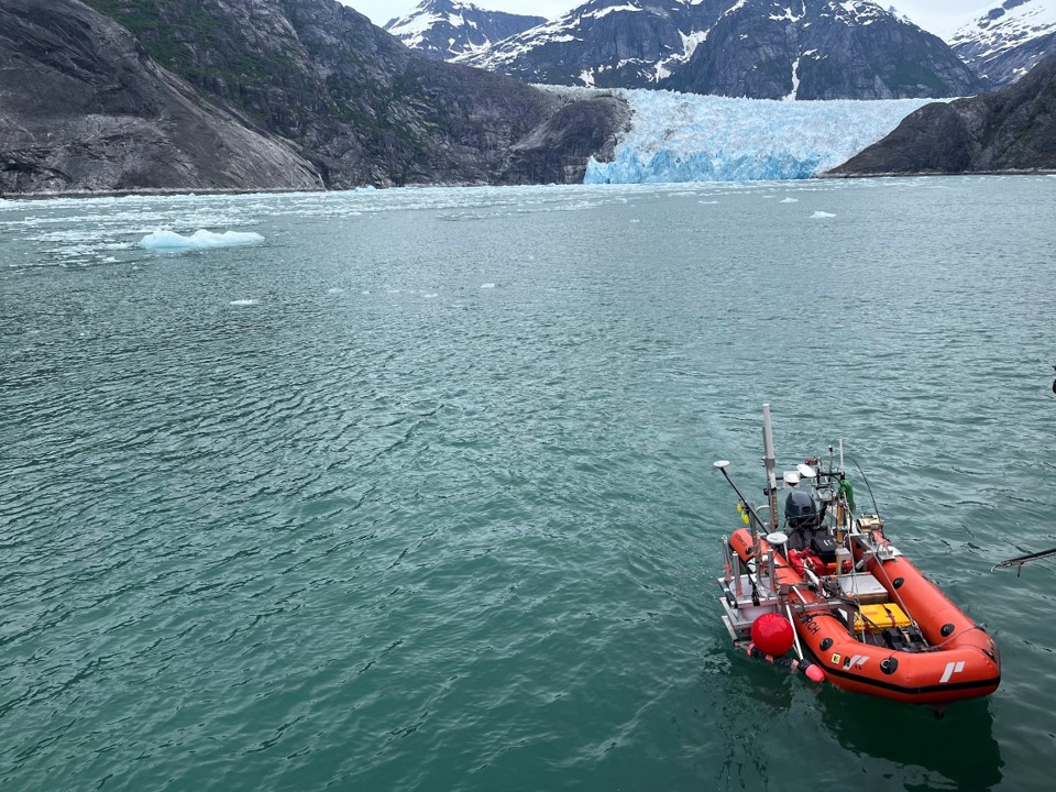 view of water, glaciers, and boat