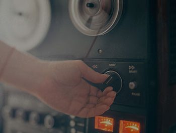 A close-up shot of a hand turning a dial.