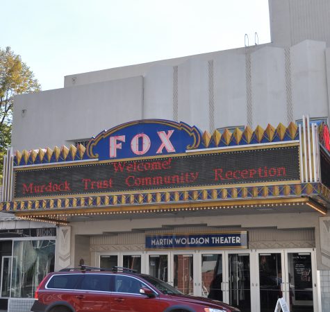 An outdoor shot of a historic theater with the sign saying "Welcome! Murdock Trust Community Reception"