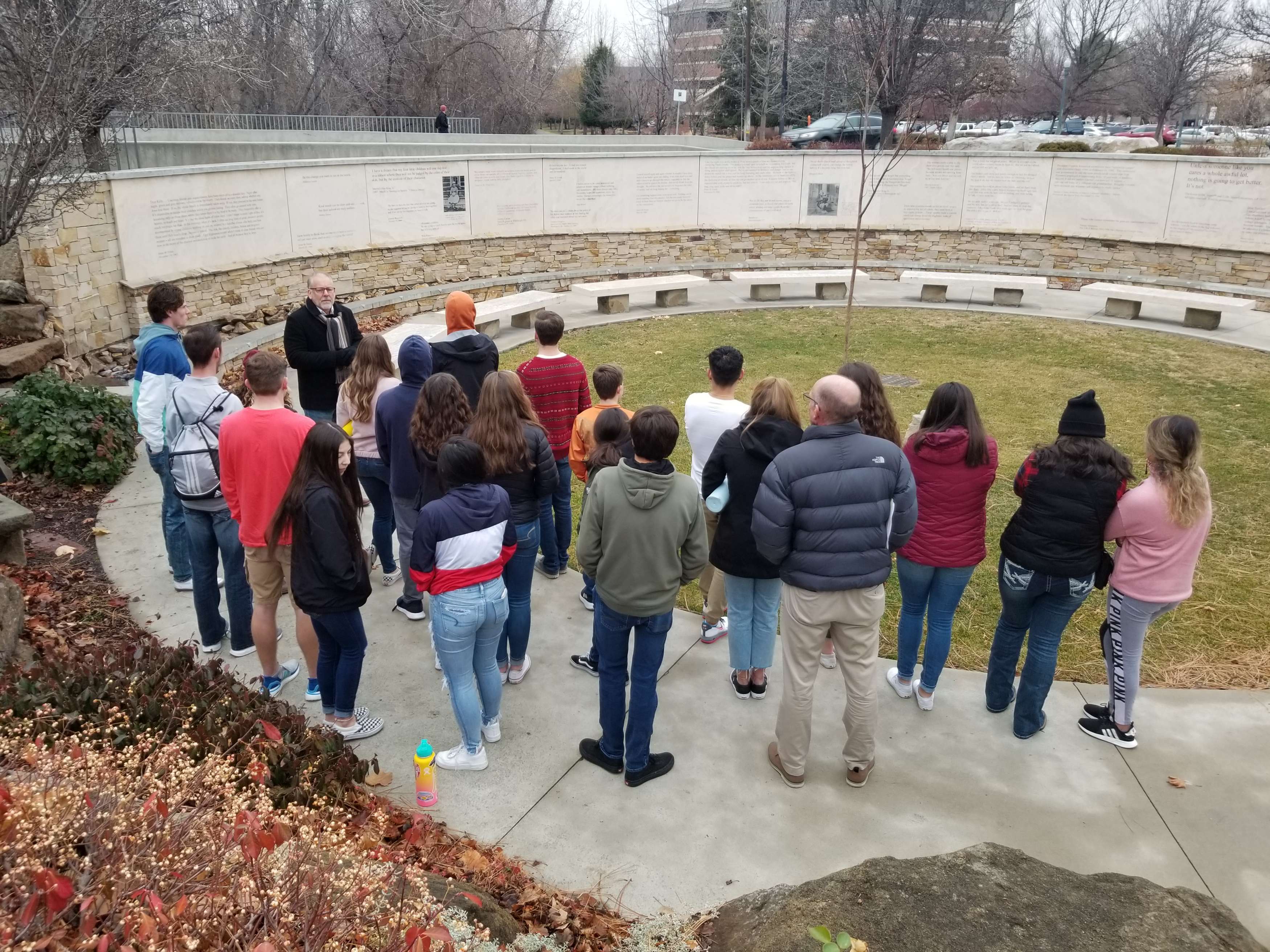 A large group receives a tour at the Anne Frank memorial in Boise, ID