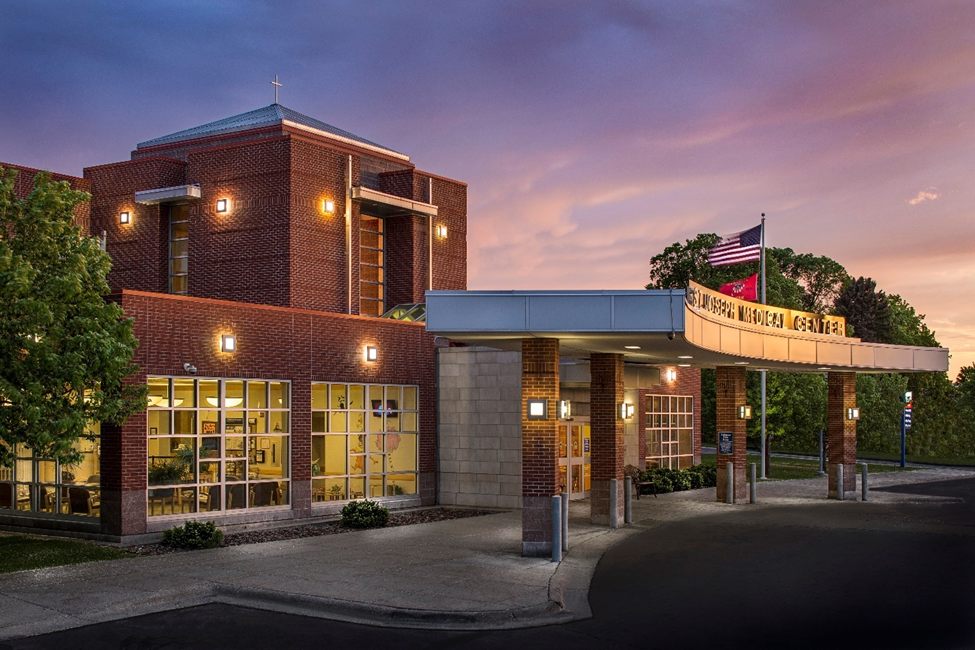 A shot of a medical clinic from outside at sunset.