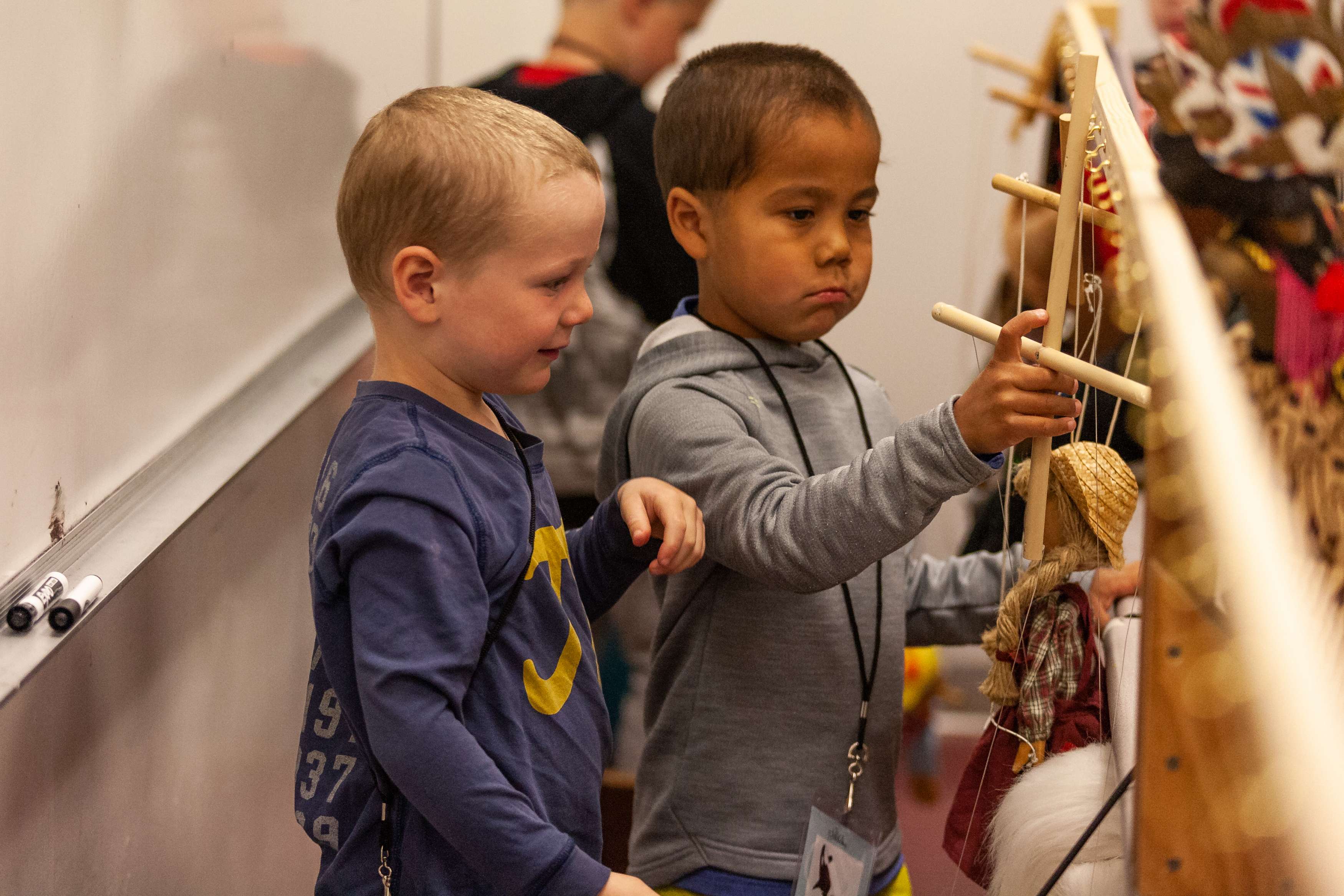 Two young students do a craft at the Sitka Fine Arts Camp