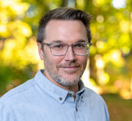 Headshot professional portrait of Dr. Michael Pitts outdoors